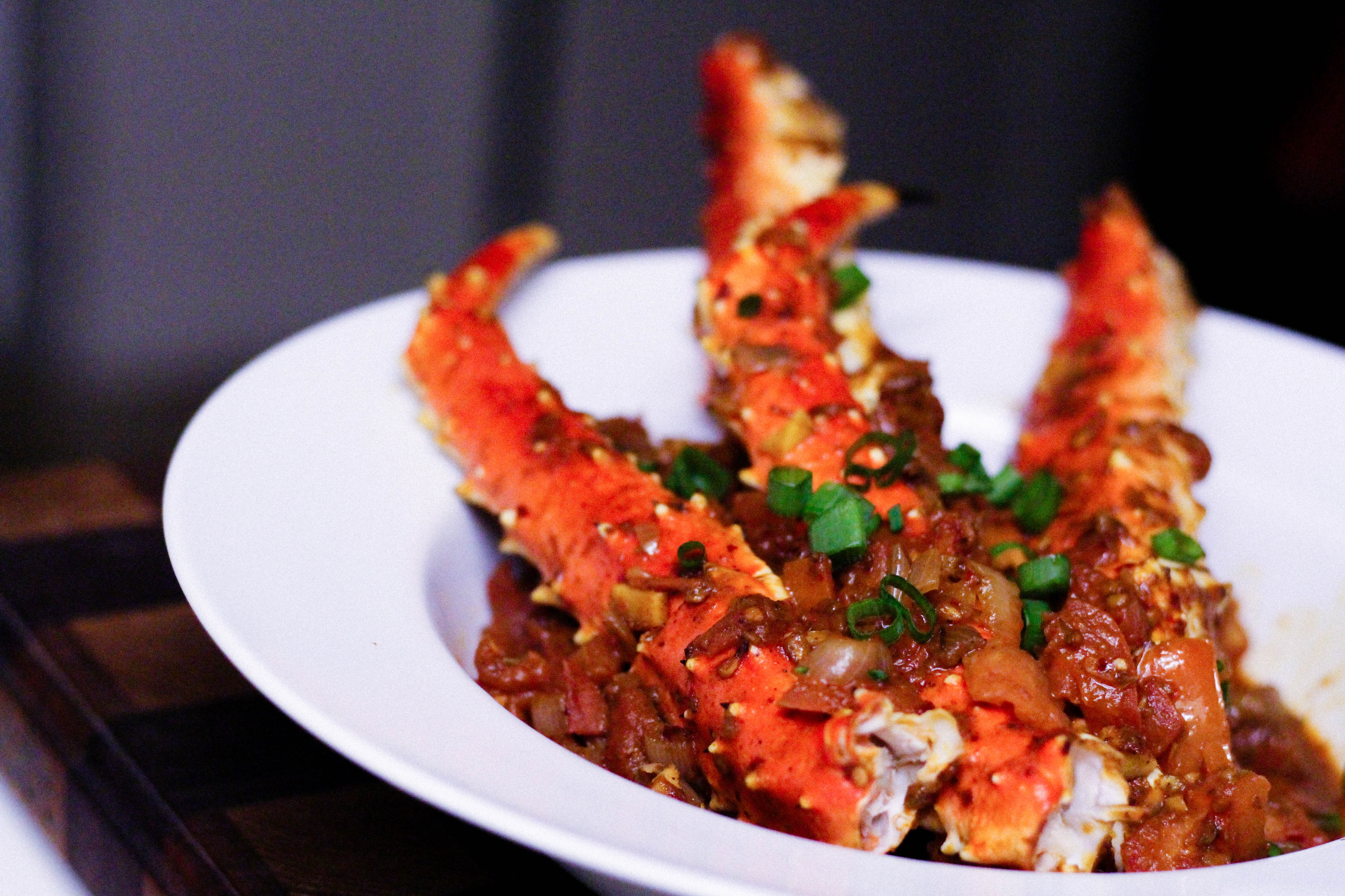 King Crab Legs with Spicy Ghanaian Shito and Tomato Sauce